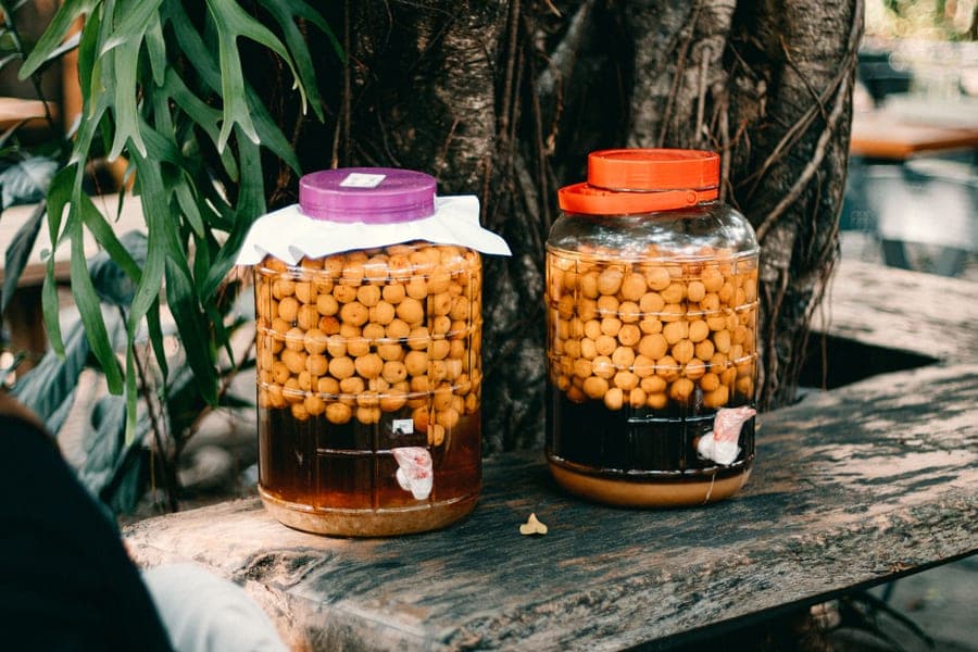 Mead making kit with a glass carboy and honey